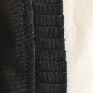 Worth lined wool skirt with pleated embellishments